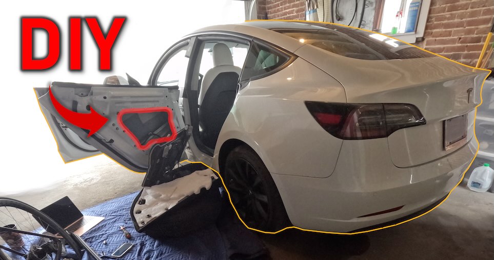 A Tesla Model 3 that is in mid-repair with its window regulator motor currently removed